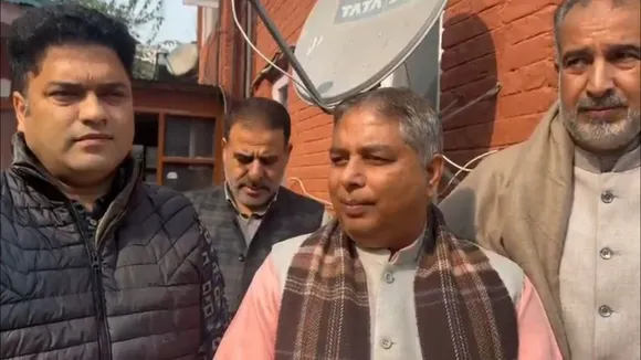 Head of the Jammu and Kashmir unit of BJP Sat Paul Sharma talking to reporters