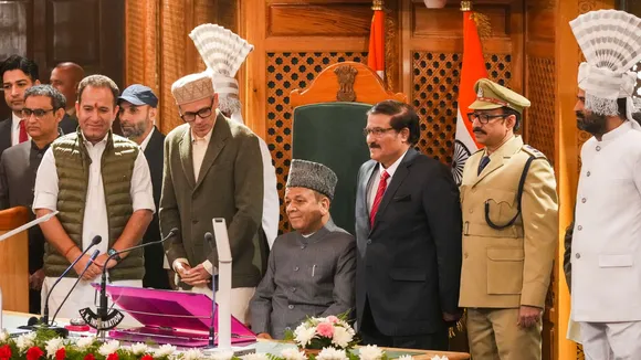 J&K CM Omar Abdullah, Speaker pro-tem Mubarak Gul and others accompany newly elected Speaker Abdul Rahim Rather (C) as he takes his chair in the Assembly during its session, in Srinagar, Monday, Nov. 4, 2024.