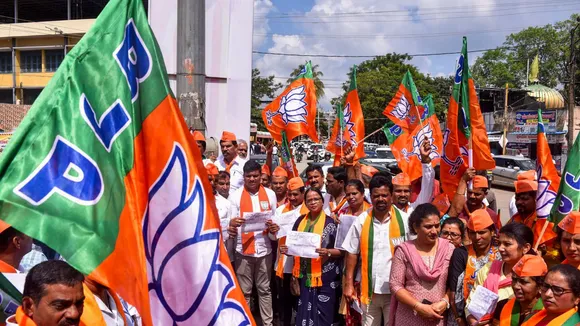 BJP workers stage a protest following allegations by farmers in several parts of Karnataka that their lands were marked as Waqf Board properties, in Chikkamagaluru district, Karnataka, Monday, Nov. 4, 2024.
