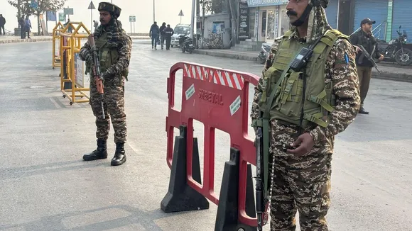 Security personnel stand on the road near the encounter site in Nehru Park area, Srinagar on November 10, 2024.