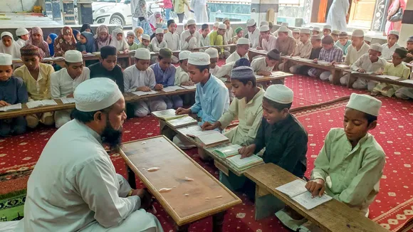 Children study at a Madrasa in Agra