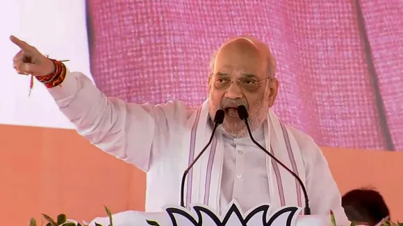 Union Home Minister Amit Shah addresses a public meeting for the Jharkhand Assembly election, in Jharia, Jharkhand.
