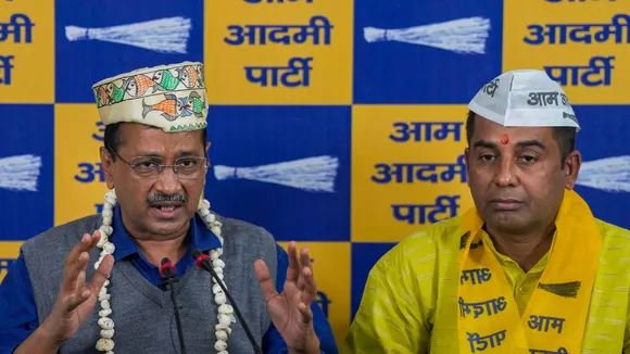 AAP national convener Arvind Kejriwal with former BJP MLA Anil Jha after the latter joined the party, at AAP office, in New Delhi, Sunday, Nov. 17, 2024.