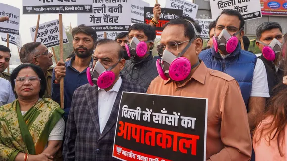 Delhi BJP President Virendra Sachdeva with MoS Harsh Malhotra and others take part in a protest on the issue of pollution, in New Delhi, Tuesday, Nov. 19, 2024.