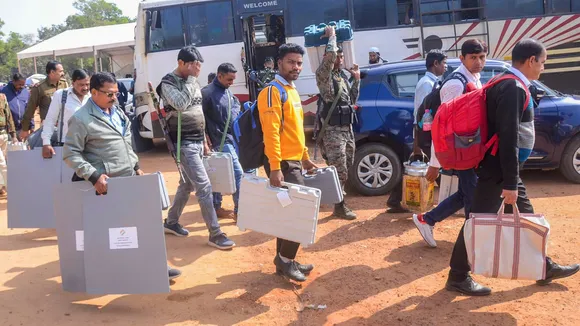 Polling officials and security personnel with EVMs and other election materials leave for their respective polling stations on the eve of voting for the last phase of Jharkhand Assembly polls, in Ranchi, Tuesday, Nov. 19, 2024.