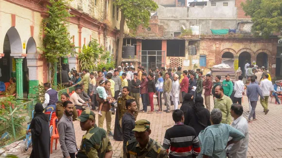 Voters waiting to cast votes at a polling booth during UP's Sishamau Assembly constituency bypoll, in Kanpur, Wednesday, Nov. 20, 2024.