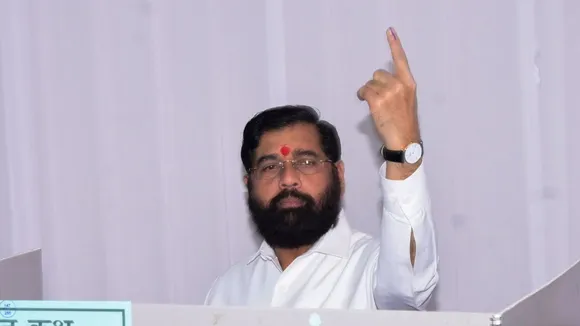 Maharashtra Chief Minister Eknath Shinde shows his ink-marked finger after casting vote during the state Assembly elections, in Thane, Maharashtra.