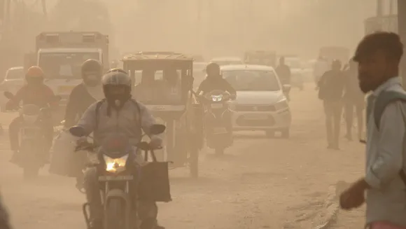 Commuters amid low visibility due to smog