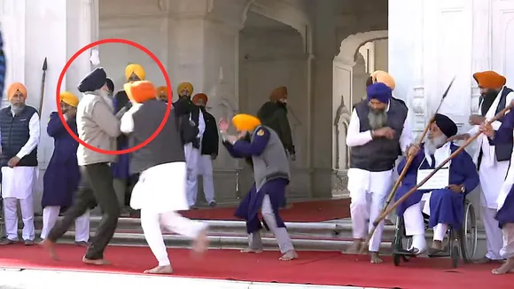 People catch a man who allegedly opened fire at Shiromani Akali Dal leader Sukhbir Singh Badal at the Golden Temple, in Amritsar, Wednesday, Dec. 4, 2024.