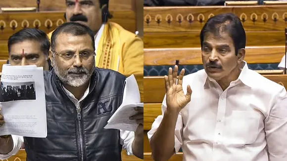 BJP MP Nishikant Dubey and Congress MP K C Venugopal speak in the Lok Sabha during the Winter session of Parliament, in New Delhi, Thursday, Dec. 5, 2024.