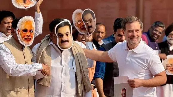 Rahul Gandhi takes a mock interview of Congress MPs Manickam Tagore and Saptagiri Sankar Ulaka, wearing face masks of Prime Minister Narendra Modi and Adani Group Chairman Gautam Adani, at Parliament, in New Delhi, Monday, Dec. 9, 2024.