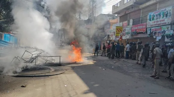 A structure set on fire during protests which continued for the second day over alleged vandalising of a replica of the Indian Constitution in Parbhani, Maharashtra on Wednesday, Dec. 11, 2024.