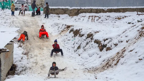 Children play in the snow as many areas in the plains of Kashmir received the season's first snowfall breaking a long dry spell, at Tangmarg in Baramulla district of J&K on Thursday, Dec. 12, 2024.