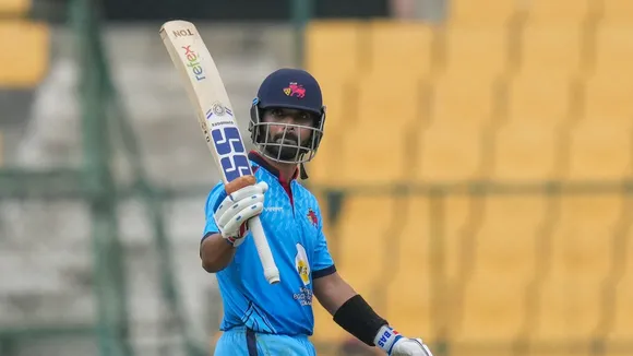 Mumbai's Ajinkya Rahane celebrates his half century during the first semi-final T20 cricket match of the Syed Mushtaq Ali Trophy between Baroda and Mumbai, at the M Chinnaswamy Stadium, in Bengaluru, Friday, Dec. 13, 2024.