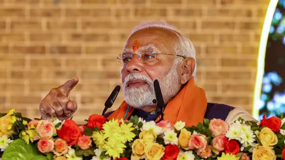 Prime Minister Narendra Modi addresses a public meeting during the inauguration of various development projects for the 2025 Maha Kumbh mela, in Prayagraj, Friday, Dec. 13, 2024.