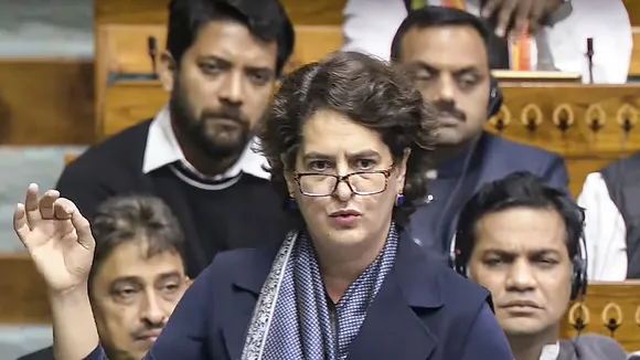 Congress MP Priyanka Gandhi Vadra speaks in the Lok Sabha during a discussion on 75th anniversary of the adoption of the Indian Constitution at the Winter session of Parliament, in New Delhi, Friday, Dec. 13, 2024.