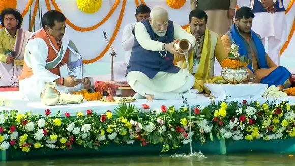 Prime Minister Narendra Modi performs worship at the Sangam, in Prayagraj, Friday, Dec. 13, 2024.