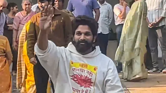 Telugu film actor Allu Arjun greets fans after he was released from the jail, at his residence in Hyderabad, Saturday, Dec. 14, 2024.