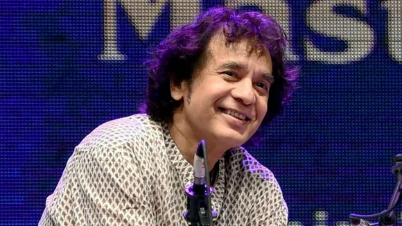 In this Monday, Jan. 9, 2017 file image Tabla maestro Ustad Zakir performs at a concert in Mumbai.
