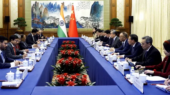 National Security Advisor Ajit Doval with Chinese Foreign Minister Wang Yi and other dignitaries during a meeting, in Beijing, China, Wednesday, Dec. 18, 2024.