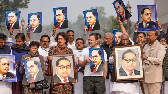 LoP in the Lok Sabha Rahul Gandhi, LoP in the Rajya Sabha Mallikarjun Kharge and other opposition MPs hold portraits of Dr BR Ambedkar during a protest amid the Winter session of Parliament, in New Delhi, Wednesday, Dec. 18, 2024.