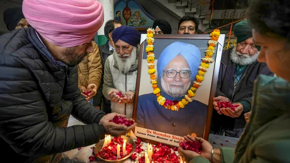 Congress supporters pay tribute to former prime minister Manmohan Singh, who died in New Delhi on Thursday, during a tribute-paying ceremony in Amritsar on Friday, Dec. 27, 2024.