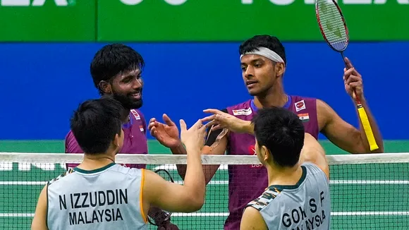 Satwiksairaj Rankireddy and Chirag Shetty congratulate Malaysia's Goh Sze Fei and Nur Izzuddin after losing the men's doubles semi-final match at the India Open 2025 badminton tournament, in New Delhi, Saturday, Jan. 18, 2025.