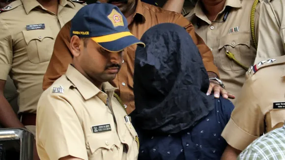 Police personnel take the accused, arrested in connection with the alleged attack on Bollywood actor Saif Ali Khan, to a hospital for medical examination before producing him at a court in Mumbai on Sunday, Jan. 19, 2025.