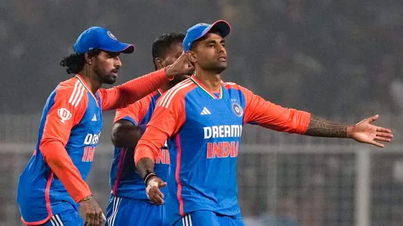 Suryakumar Yadav, right, Tilak Varma, left, and Hardik Pandya, back center, after the end of the first innings during the first T20I cricket match of a series between India and England at the Eden Gardens in Kolkata on Wednesday, Jan. 22, 2025.