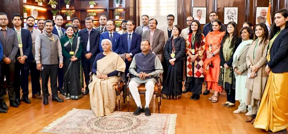 Nirmala Sitharaman poses for group photo with Minister of State Pankaj Chaudhary and the full budget 2025-26 team after giving final touches to the Union Budget in New Delhi on Friday, Jan. 31, 2025.