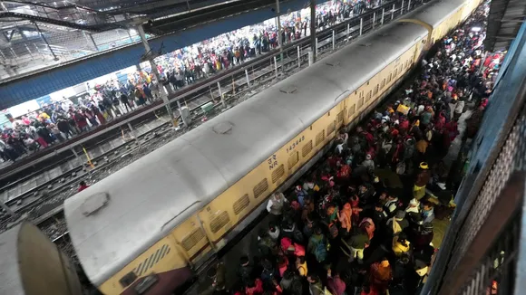 Heavy rush of passengers to catch a train for Mahakumbh at the New Delhi railway station on Saturday, Feb. 15, 2025. 