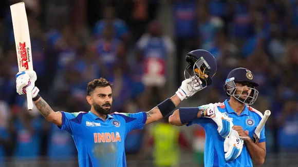 Virat Kohli, left, celebrates his century with Axar Patel after scoring the winning runs during the ICC Champions Trophy match against Pakistan in Dubai on Sunday, Feb. 23, 2025.