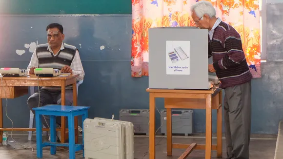 A voter casts vote at a polling booth during the Haryana municipal elections, in Gurugram, Sunday, March 2, 2025.