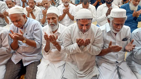 Muslim devotees offer namaz
