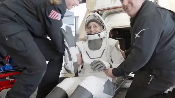 This image taken from video provided by SpaceX shows NASA's Sunita Williams being helped after exiting the SpaceX capsule on Tuesday, March 18, 2025.