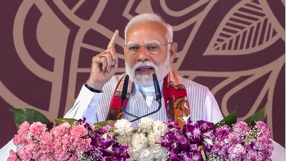 Prime Minister Narendra Modi addresses the gathering during foundation stone laying and inauguration of development works, in Varanasi.