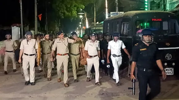 Police and security personnel keep a vigil at an area amid protests over the Waqf (Amendment) Act in Murshidabad on Saturday, April 12, 2025.