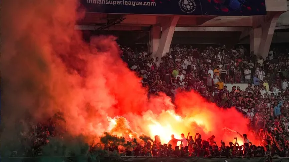 MBGS supporters light flares in celebration after the club won ISL 2024-25 final football match against Bengaluru FC, at Vivekananda Yuba Bharati Krirangan, in Kolkata.