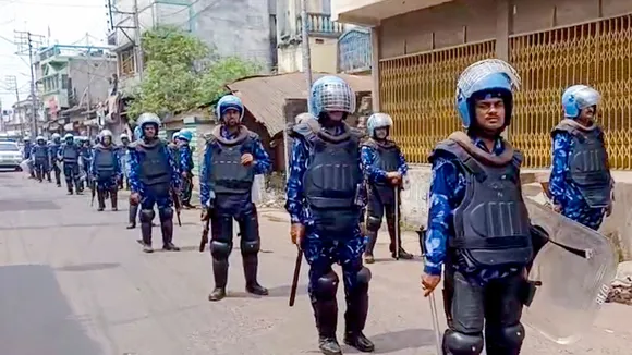Security personnel stand guard in a violence-affected area, in Murshidabad district, West Bengal.