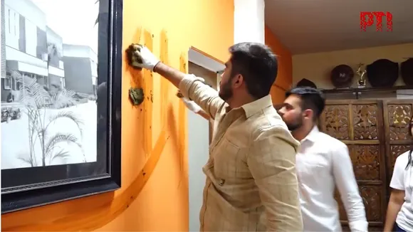 DUSU president Ronak Khatri defaces Laxmibai College Prinicipla office.