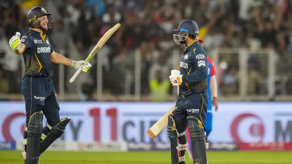 Gujarat Titans' Jos Buttler and Rahul Tewatia celebrate their win against Delhi Capitals at Narendra Modi Stadium in Ahmedabad on Saturday, April 19, 2025.