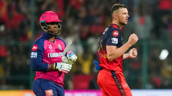 Royal Challengers Bengaluru's Josh Hazlewood celebrates the wicket of Rajasthan Royals' Shimron Hetmyer as the latter walks off the field at M Chinnaswamy stadium in Bengaluru on Thursday, April 24, 2025.