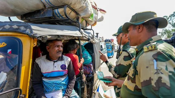 BSF personnel check documents of Pakistan citizens arrived to cross over to their country, at Attari-Wagah border near Amritsar.