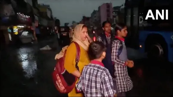 School children after early morning heavy rainfall, strong winds and lightning.
