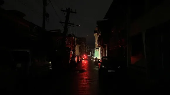 Vehicles stand parked on a road during blackout in view of the ongoing military conflict between India and Pakistan in Srinagar on Friday, May 9, 2025.