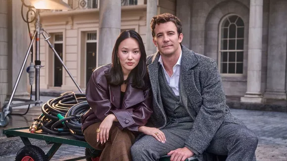 Yerin Ha and Luke Thompson pose together ahead of the upcoming season of Bridgerton.