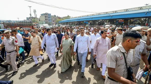 Delhi Chief Minister Rekha Gupta with Cabinet Minister Kapil Mishra and BJP leader Raj Kumar Bhatia during a visit at Azadpur Mandi, in New Delhi.