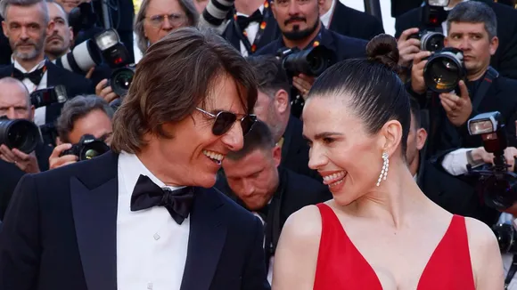 Tom Cruise, left, and Hayley Atwell pose for photographers upon arrival at the premiere of the film 'Mission: Impossible - The Final Reckoning' at the 78th international film festival, Cannes, southern France.