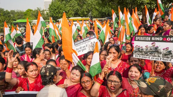 BJP women workers attend a Tiranga Rally to hail the Indian armed forces' Operation Sindoor, in New Delhi.