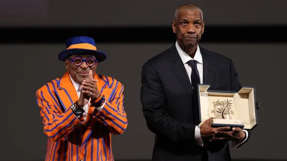  Spike Lee presented Denzel Washington with the Honorary Palme d'Or ahead of the screening of their new film Highest 2 Lowest at the Cannes Film Festival on Monday. 